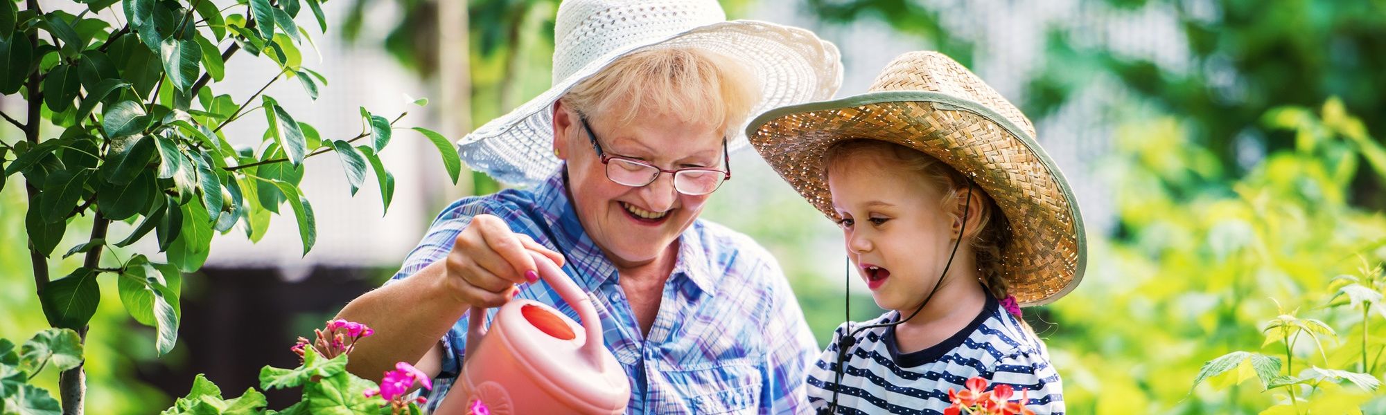 Grandmother gardening with a kid