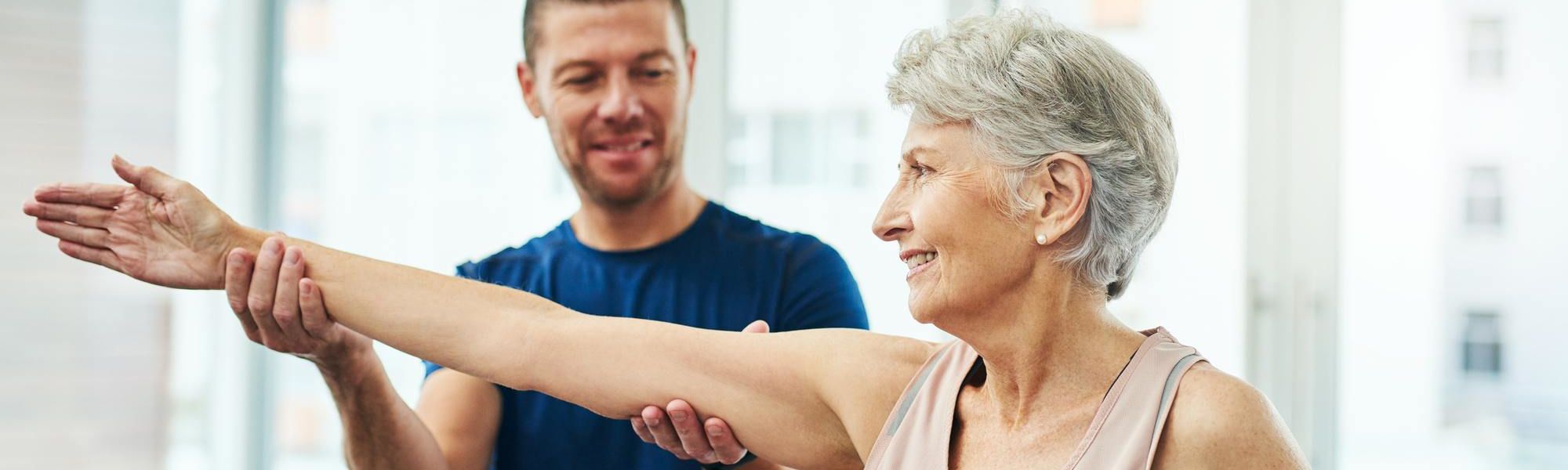 physiotherapist working with a senior female patient