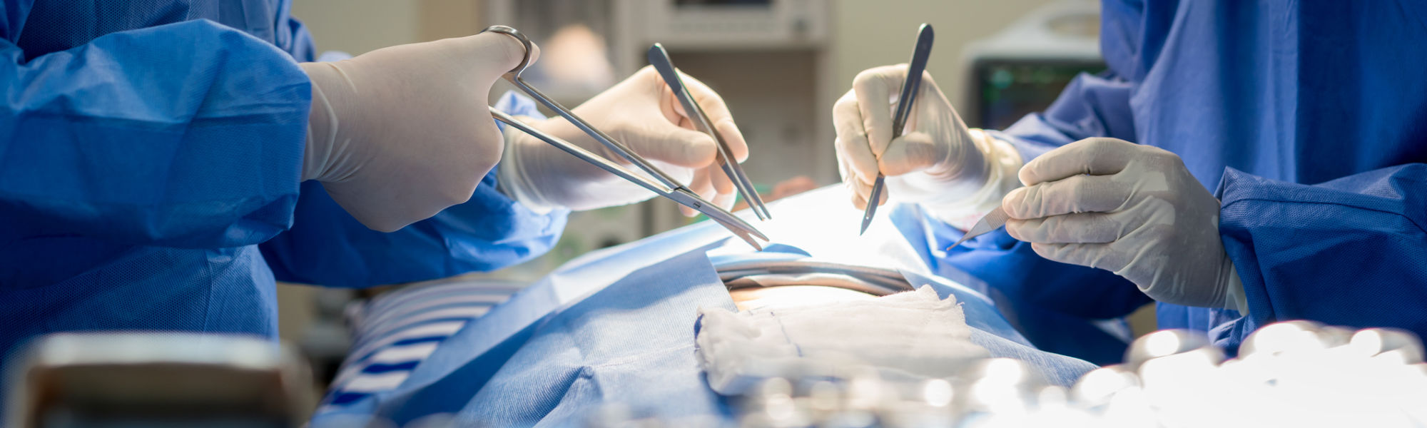 Surgeon and an assistant in surgery