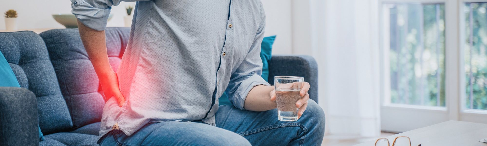 Painful guy aching from pain in back or reins at home