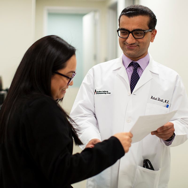 Doctor and staff looking at papework