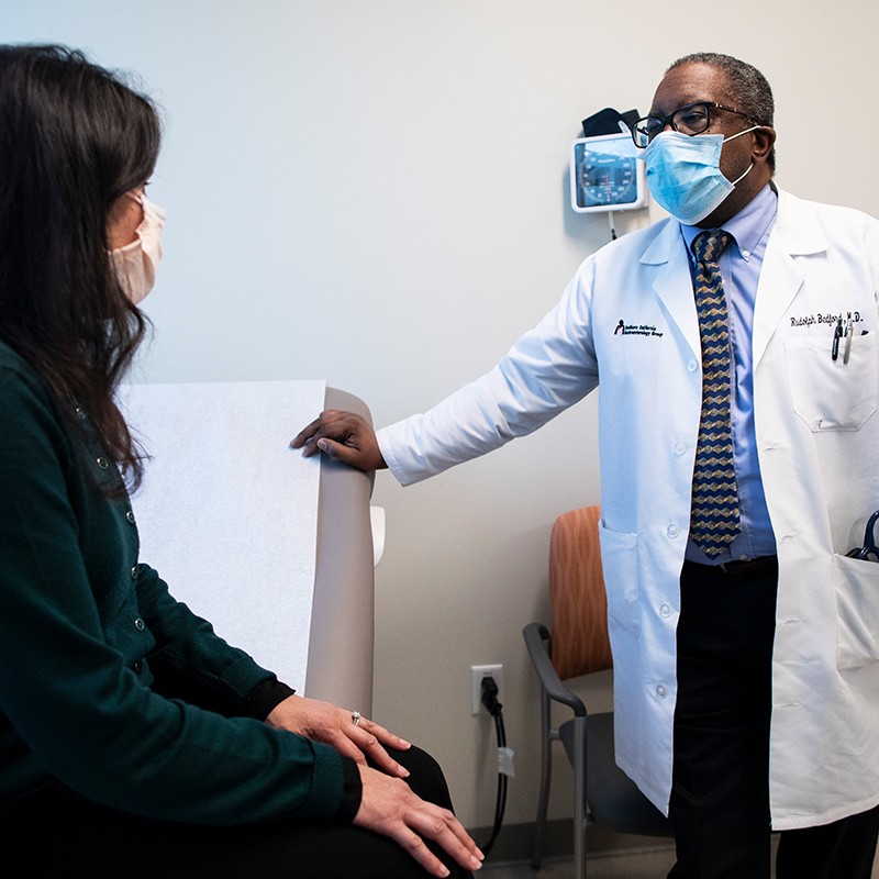 A doctor speaking with his patient