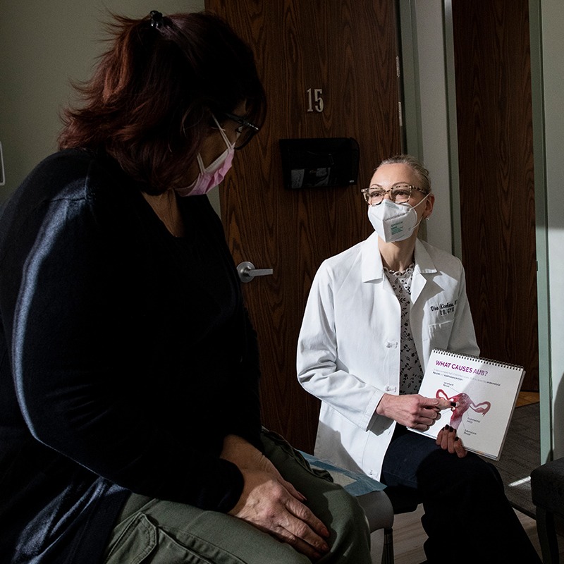 Seated doctor and patient